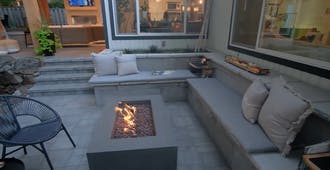 Stone paved stairs and bench with fire pit