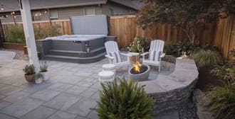 Stone pavers with retaining walls and fire pit